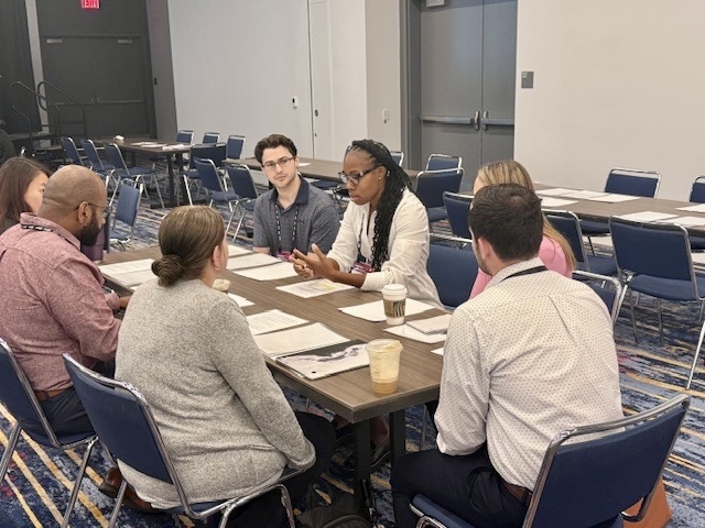 Jahmae facilitating a small-group nutrition discussion